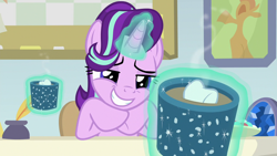 Size: 1280x720 | Tagged: safe, screencap, character:starlight glimmer, species:pony, species:unicorn, episode:marks for effort, g4, my little pony: friendship is magic, chocolate, desk, empathy cocoa, female, food, geode, glowing horn, guidance counselor, hoof under chin, hot chocolate, levitation, lidded eyes, magic, mare, marshmallow, offering, smiling, solo, starlight's office, teeth, telekinesis