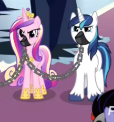 Size: 673x724 | Tagged: safe, screencap, character:princess cadance, character:shining armor, species:pony, species:unicorn, episode:the beginning of the end, g4, my little pony: friendship is magic, chains, cropped, duo focus, female, gag, male, mare, muzzle, muzzle gag, prisoner, sombra soldier, stallion