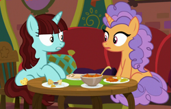 Size: 587x376 | Tagged: safe, screencap, character:pretzel twist, character:say cheese, species:pony, species:unicorn, episode:the point of no return, g4, my little pony: friendship is magic, background pony, cropped, duo, female, food, looking at each other, mare, sitting, table, the tasty treat