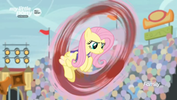 Size: 1366x768 | Tagged: safe, screencap, character:fluttershy, species:pony, episode:common ground, g4, my little pony: friendship is magic, audience, blurry, crowd, fast, flag, good trick, lights, solo, spinning, spotlight, stadium