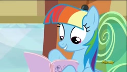 Size: 1280x720 | Tagged: safe, screencap, character:rainbow dash, species:pegasus, species:pony, episode:the lost treasure of griffonstone, g4, my little pony: friendship is magic, alternate hairstyle, book, discovery family logo, fake smile, female, hoof hold, imitation, looking down, manebow sparkle, manual, multicolored hair, reading, solo, train