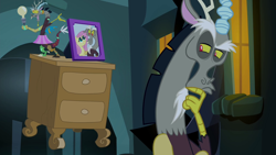Size: 1280x720 | Tagged: safe, screencap, character:discord, character:fluttershy, species:draconequus, episode:twilight's kingdom, g4, my little pony: friendship is magic, discord lamp, hand on chin, lamp, male, picture frame, solo, thinking
