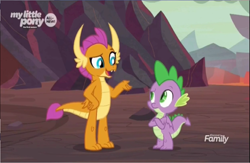 Size: 1366x892 | Tagged: safe, screencap, character:smolder, character:spike, species:dragon, episode:sweet and smoky, g4, my little pony: friendship is magic, claws, crossed arms, discovery family logo, dragon lands, dragoness, duo, fangs, female, folded wings, horns, male, metaphor, raised arm, raised eyebrow, winged spike, wings