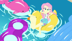 Size: 1280x720 | Tagged: safe, screencap, character:fluttershy, episode:i'm on a yacht, g4, my little pony:equestria girls, barefoot, clothing, eyeshadow, feet, flutterfeet, foot focus, lidded eyes, makeup, pool toy, shorts, soles, solo, swimming pool, wiggling toes