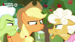 Size: 1600x900 | Tagged: safe, screencap, character:applejack, character:goldie delicious, character:granny smith, species:earth pony, species:pony, episode:going to seed, g4, my little pony: friendship is magic, angry, apple, apple tree, argument, discovery family logo, duckface, female, food, mare, my little pony logo, narrowed eyes, suspicious, tree, trio, unamused, unhappy, upset