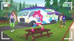 Size: 1366x768 | Tagged: safe, screencap, character:pinkie pie, episode:five lines you need to stand in, g4, my little pony:equestria girls, background human, duke suave, female, male, picnic table, pose, raspberry lilac, rv, space camp (character), table