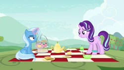 Size: 1920x1080 | Tagged: safe, screencap, character:starlight glimmer, character:trixie, species:pony, episode:student counsel, bracelet, cup, cupcake, food, jewelry, kettle, magic, picnic blanket, sandwich, teacup, unamused