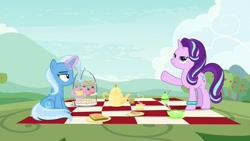 Size: 1920x1080 | Tagged: safe, screencap, character:starlight glimmer, character:trixie, species:pony, species:unicorn, episode:student counsel, bracelet, cup, duo, female, jewelry, magic, magic aura, mare, pager, picnic, picnic blanket, starlight's bracelet, starlight's hoofband, teacup, teapot, telekinesis