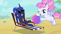 Size: 1920x1080 | Tagged: safe, screencap, character:cotton puff, character:princess luna, species:alicorn, species:pegasus, species:pony, episode:between dark and dawn, g4, my little pony: friendship is magic, alternate hairstyle, background pony, beach, beach ball, beach chair, blank flank, crossed hooves, crossed legs, cute, female, filly, flapping, flying, hair bun, having fun, hooves behind head, looking at someone, reclining, relaxing, smiling, spread wings, sunglasses, tropical, vacation, we don't normally wear clothes, wings