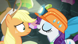Size: 1920x1080 | Tagged: safe, screencap, character:applejack, character:rarity, species:earth pony, species:pegasus, species:pony, episode:dragon dropped, g4, my little pony: friendship is magic, bow, clothing, duo, eyes closed, female, freckles, gem cave, gemstones, hat, helmet, light, mare, mining helmet, wut face