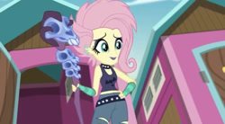 Size: 750x414 | Tagged: safe, screencap, character:fluttershy, episode:the road less scheduled, g4, my little pony:equestria girls, alternate hairstyle, choker, clothing, eyeliner, eyeshadow, female, flutterpunk, lipstick, makeup, midriff, purple lipstick, skull, solo, spiked choker, staff, tank top, the road less scheduled: fluttershy