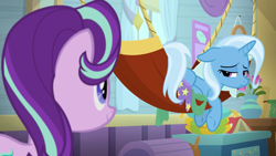 Size: 1920x1080 | Tagged: safe, screencap, character:starlight glimmer, character:trixie, species:pony, episode:a horse shoe-in, g4, my little pony: friendship is magic, book, chest, flower, hammock, looking at each other, looking over shoulder, sad, trixie's wagon, vase, wagon, window