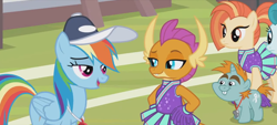 Size: 1298x588 | Tagged: safe, screencap, character:rainbow dash, character:smolder, character:snips, species:dragon, species:pegasus, species:pony, species:unicorn, episode:2-4-6 greaaat, bucktooth, cheerleader, cheerleader outfit, cheerleader smolder, clothing, coach rainbow dash, coaching cap, colt, dragoness, eyeshadow, fangs, female, foal, folded wings, frown, hands on hip, horns, lidded eyes, makeup, male, mare, multicolored hair, pom pom, ponytail, raised eyebrow, smiling, smirk, talking, teacher and student, teenaged dragon, teenager, whistle necklace