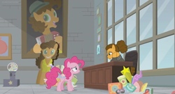 Size: 1366x738 | Tagged: safe, screencap, character:cheese sandwich, character:pinkie pie, species:pony, episode:the last laugh, g4, my little pony: friendship is magic, alternate hairstyle, bust, cardboard cutout, chair, clothing, factory, gag factory, gumball machine, hair bun, hoof on cheek, office, picture frame, portrait, sad, sweater, toy, window