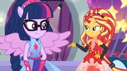 Size: 1080x606 | Tagged: safe, screencap, character:sunset shimmer, character:twilight sparkle, character:twilight sparkle (scitwi), species:eqg human, equestria girls:rollercoaster of friendship, g4, my little pony:equestria girls, eye contact, glasses, looking at each other, ponied up, pony ears, scitwilicorn, smiling, super ponied up
