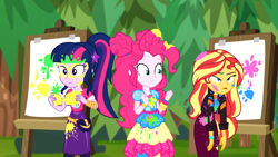 Size: 1916x1080 | Tagged: safe, screencap, character:pinkie pie, character:sunset shimmer, character:twilight sparkle, character:twilight sparkle (scitwi), species:eqg human, equestria girls:sunset's backstage pass, g4, my little pony:equestria girls, canvas, easel, female, geode of sugar bombs, geode of telekinesis, magical geodes, messy, messy hair, outdoors, paint, painting, ponytail, sunset shimmer is not amused, trio, trio female, unamused