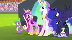Size: 1280x720 | Tagged: safe, screencap, character:princess cadance, character:princess celestia, character:princess luna, character:spike, species:alicorn, species:dragon, species:pony, episode:equestria games, g4, my little pony: friendship is magic, all new, crown, crystal stadium, female, happy, hub logo, jewelry, male, mare, open mouth, regalia, spread wings, text, wings