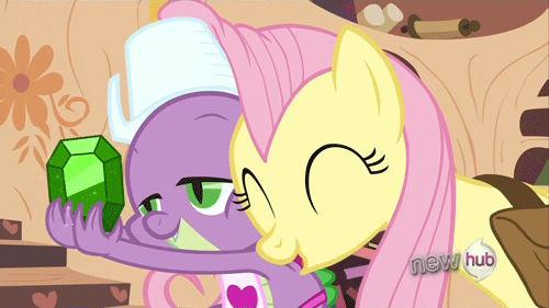 Size: 500x281 | Tagged: safe, screencap, character:fluttershy, character:spike, episode:just for sidekicks, g4, my little pony: friendship is magic, 'new', animated, apron, clothing, cute, emerald, gem, golden oaks library, hub logo, naked apron, shyabetes, snuggling, spikelove