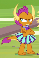 Size: 318x478 | Tagged: safe, screencap, character:smolder, species:dragon, episode:2-4-6 greaaat, angry, cheerleader outfit, cheerleader smolder, claws, clothing, confetti, cropped, cute, displeased, dragoness, fangs, female, horns, madorable, skirt, smolderbetes, solo, teenaged dragon, toes, unamused, upset