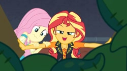 Size: 953x534 | Tagged: safe, screencap, character:fluttershy, character:sunset shimmer, episode:costume conundrum, g4, my little pony:equestria girls, costume conundrum: sunset shimmer, geode of empathy, looking at you, magical geodes, scared, she knows
