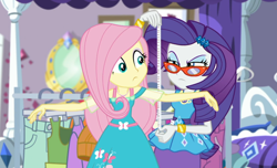 Size: 1598x970 | Tagged: safe, screencap, character:fluttershy, character:rarity, episode:costume conundrum, g4, my little pony:equestria girls, bed, bracelet, clothes rack, costume conundrum: rarity, cropped, duo, duo female, eyeshadow, female, geode of fauna, geode of shielding, glasses, jewelry, lidded eyes, magical geodes, makeup, measuring, measuring tape, rarity's bedroom, rarity's glasses