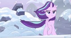 Size: 1917x1031 | Tagged: safe, screencap, character:starlight glimmer, species:pony, species:unicorn, episode:the ending of the end, g4, my little pony: friendship is magic, badass, female, frown, lidded eyes, like a boss, mare, raised hoof, snow, solo, walking away, windswept mane
