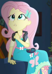 Size: 673x964 | Tagged: safe, screencap, character:fluttershy, episode:costume conundrum, g4, my little pony:equestria girls, controller, couch, cropped, female, geode of fauna, headset, headset mic, magical geodes, sitting, solo, sunset's apartment, thinking