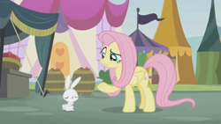 Size: 1600x900 | Tagged: safe, screencap, character:angel bunny, character:fluttershy, species:pegasus, species:pony, species:rabbit, episode:she talks to angel, g4, my little pony: friendship is magic, animal, barrel, barrels, body swap, duo, eyes closed, female, folded wings, male, mare, market, ponyville, raised eyebrow, raised hoof, stall, tents, wings