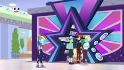 Size: 1280x720 | Tagged: safe, screencap, character:desert sage, character:rainbow dash, character:zephyr breeze, equestria girls:holidays unwrapped, g4, my little pony:equestria girls, background human, canterlot mall, cap, clothing, converse, dashing through the mall, desert sage, eyes closed, female, geode of super speed, hat, magical geodes, male, mile hill, no socks, orange sunrise, pants, plusplus, shoes, skirt, sneakers, socks, waldo whereabout