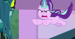 Size: 1673x879 | Tagged: safe, screencap, character:queen chrysalis, character:starlight glimmer, species:changeling, species:pony, species:unicorn, episode:the ending of the end, g4, my little pony: friendship is magic, angry, cutie mark, duo, fangs, female, former queen chrysalis, glowing horn, gritted teeth, horn, jumping, leaping, magic, mare, open mouth, school of friendship, spoiler, ultimate chrysalis