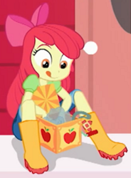 Size: 1033x1404 | Tagged: safe, screencap, character:apple bloom, equestria girls:holidays unwrapped, g4, my little pony:equestria girls, apple bloom's bow, boots, bow, box, clothing, cropped, cute, female, hair bow, jeans, net, pants, shoes, solo, tongue out
