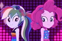 Size: 1045x689 | Tagged: safe, screencap, character:pinkie pie, character:rainbow dash, episode:i'm on a yacht, g4, my little pony:equestria girls, dancing, neon eg logo, photo, sleeveless, smiling