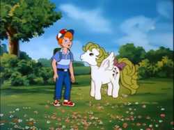 Size: 771x577 | Tagged: safe, screencap, character:danny williams, character:surprise, episode:the great rainbow caper, g1, my little pony 'n friends, adoraprise, backpack, baseball cap, bow, cap, clothing, cute, dannybetes, hat, tail bow, tree