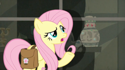 Size: 1600x900 | Tagged: safe, screencap, character:fluttershy, species:pegasus, species:pony, episode:daring doubt, g4, my little pony: friendship is magic, female, mare, saddle bag, screen, solo, vase
