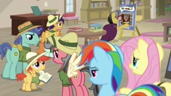 Size: 1920x1080 | Tagged: safe, screencap, character:a.k. yearling, character:compass course, character:fluttershy, character:peach fuzz, character:rainbow dash, species:earth pony, species:pegasus, species:pony, episode:daring doubt, g4, my little pony: friendship is magic, background pony, book, bookshelf, clothing, cosplay, costume, daring do cosplay, fake wings, female, hat, male, mare, pith helmet, stallion, unnamed pony