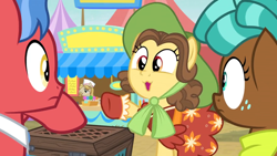 Size: 1600x900 | Tagged: safe, screencap, character:biscuit, character:jeff letrotski, character:may fair, character:spur, species:pony, episode:growing up is hard to do, g4, my little pony: friendship is magic, box, candy, chest, clothing, dress, food, food stand, hat, lollipop, neckerchief, sun hat, vendor