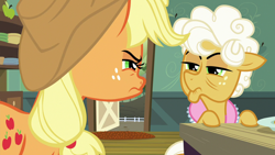 Size: 1280x720 | Tagged: safe, screencap, character:applejack, character:goldie delicious, species:earth pony, species:pony, episode:going to seed, g4, my little pony: friendship is magic, clothing, female, freckles, frown, hat, mare