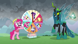 Size: 1920x1080 | Tagged: safe, screencap, character:applejack, character:fluttershy, character:pinkie pie, character:queen chrysalis, character:rainbow dash, character:rarity, character:twilight sparkle, species:earth pony, species:pony, episode:the ending of the end, g4, my little pony: friendship is magic, annoyed, armor, bewitching bell, clothing, duo, fake moustache, female, final battle, former queen chrysalis, glare, grogar's bell, hat, hoof shoes, looking at each other, mane six, mare, pinkie being pinkie, snarling, ultimate chrysalis, wheel of fortune