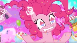 Size: 1677x942 | Tagged: safe, screencap, character:pinkie pie, species:pony, episode:the ending of the end, g4, my little pony: friendship is magic, balloon, chaos pinkie, confetti, cupcake, food, giant pony, grogar's bell, macro, run for your lives, wingding eyes, xk-class end-of-the-world scenario