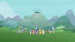 Size: 1366x768 | Tagged: safe, screencap, character:applejack, character:flash magnus, character:fluttershy, character:gallus, character:meadowbrook, character:mistmane, character:ocellus, character:pinkie pie, character:rainbow dash, character:rarity, character:rockhoof, character:sandbar, character:silverstream, character:smolder, character:somnambula, character:spike, character:star swirl the bearded, character:twilight sparkle, character:twilight sparkle (alicorn), character:yona, species:alicorn, species:changedling, species:dragon, species:pony, episode:the ending of the end, g4, my little pony: friendship is magic, crowd, hill, mane six, mountain, pillars of equestria, student six, winged spike