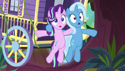 Size: 1920x1080 | Tagged: safe, screencap, character:starlight glimmer, character:trixie, species:pony, episode:on the road to friendship, carriage, female, mare, open mouth, pushing, surprised, trixie's wagon, wagon, we're friendship bound