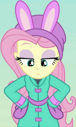 Size: 566x948 | Tagged: safe, screencap, character:fluttershy, equestria girls:holidays unwrapped, g4, my little pony:equestria girls, bunny ears, clothing, cropped, female, jacket, lidded eyes, mittens, raised eyebrows, solo, winter hat, winter outfit