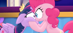 Size: 1258x568 | Tagged: safe, screencap, character:pinkie pie, character:twilight sparkle, character:twilight sparkle (alicorn), species:alicorn, species:earth pony, species:pony, my little pony: the movie (2017), angry, duo, eye bulging, eye contact, female, hooves on cheeks, looking at each other, mare, serious