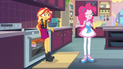 Size: 1600x894 | Tagged: safe, screencap, character:pinkie pie, character:sunset shimmer, equestria girls:holidays unwrapped, g4, my little pony:equestria girls, apron, boots, bow, bowl, cabinet, clothing, confused, drawer, kitchen, lotus position, meditation, mug, oven, oven mitt, pan, rug, shelf, shoes, slippers, stove, timer, zen