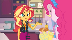 Size: 1600x900 | Tagged: safe, screencap, character:pinkie pie, character:sunset shimmer, equestria girls:holidays unwrapped, g4, my little pony:equestria girls, bow, confused, cup, duo, duo female, egg beater, female, hair bow, kitchen, mixer, oven mitts, pan, pitcher, ramekin, souffle