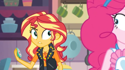 Size: 1600x900 | Tagged: safe, screencap, character:pinkie pie, character:sunset shimmer, equestria girls:holidays unwrapped, g4, my little pony:equestria girls, apron, bowl, clothing, colander, cup, jacket, kitchen, looking back, timer