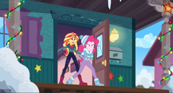 Size: 1600x866 | Tagged: safe, screencap, character:pinkie pie, character:sunset shimmer, equestria girls:holidays unwrapped, g4, my little pony:equestria girls, boots, christmas, christmas lights, clothing, coat, column, door, holiday, house, jacket, lantern, mailbox, saving pinkie's pie, shoes, stars, toque, winter outfit