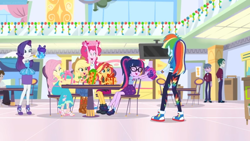Size: 1600x900 | Tagged: safe, screencap, character:applejack, character:fluttershy, character:pinkie pie, character:rainbow dash, character:rarity, character:sunset shimmer, character:twilight sparkle, character:twilight sparkle (scitwi), species:eqg human, equestria girls:holidays unwrapped, g4, my little pony:equestria girls, box, canterlot mall, clothing, converse, cowboy hat, denim skirt, dress, food court, gift box, glasses, hat, high heels, humane five, humane seven, humane six, miniskirt, pants, ponytail, present, shoes, sitting, skirt, sneakers, stetson, table, wristband