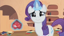 Size: 853x480 | Tagged: safe, screencap, character:rarity, species:pony, species:unicorn, episode:secret of my excess, g4, my little pony: friendship is magic, cute, dilated pupils, female, fire ruby, golden oaks library, happy, looking at you, mare, raribetes, smiling, solo