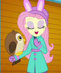 Size: 906x1080 | Tagged: safe, screencap, character:fluttershy, species:bird, species:owl, equestria girls:holidays unwrapped, g4, my little pony:equestria girls, chad (owl), clothing, coat, cropped, cute, eyes closed, female, fluttershy's winter hat, hat, mittens, open mouth, self-storage facility, shyabetes, winter coat, winter hat, winter outfit